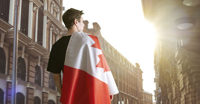 Young man holding canada flag